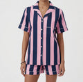 Detail of blue and pink stripe cotton PJ set by Ilk Collective